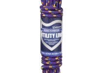 Boater handling Attwood 11704-2 rope, demonstrating its utility and versatility in marine tasks.