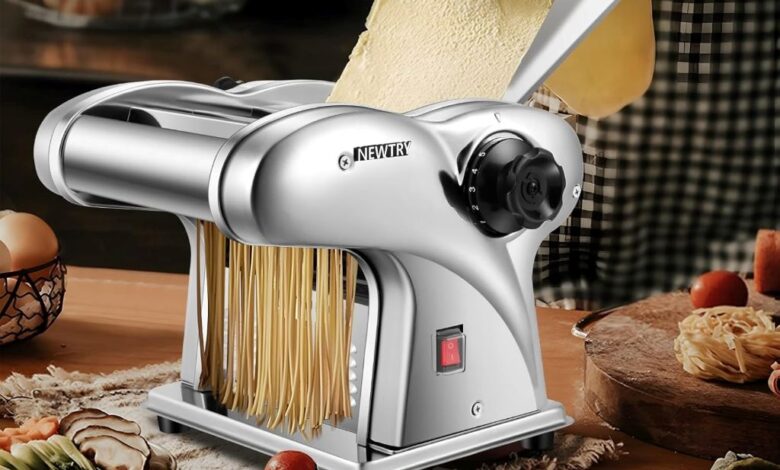 Kitchen counter with automatic NEWTRY pasta maker and fresh pasta ready to cook.