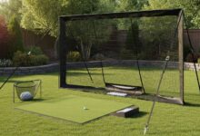 Quality golf practice net setup in backyard with proper anchoring and ball return system