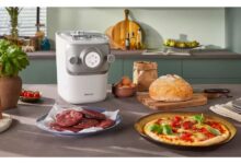 Home cook using a pasta maker for quick and easy pasta preparation